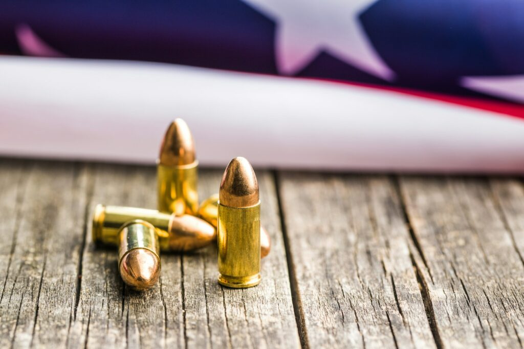 Pistol bullet and USA flag.